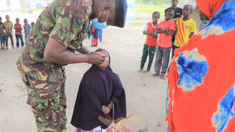 KDF MEDICS ADMINISTER POLIO VACCINATION TO CHILDREN IN BONI