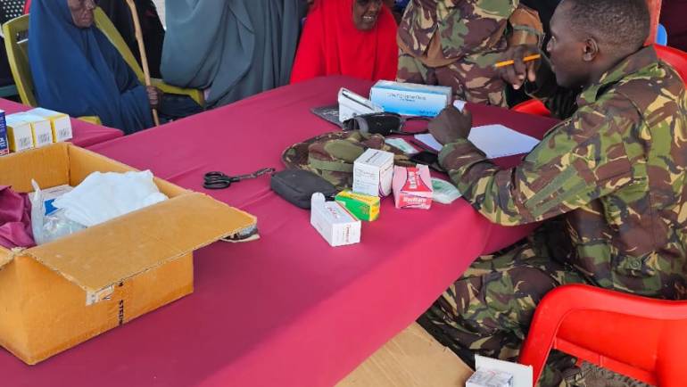 KDF TROOPS EXTEND MEDICAL CARE AND FOOD SUPPORT